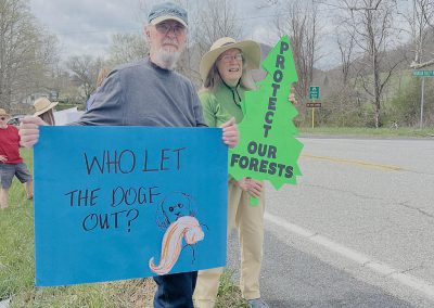 Man and woman with protest signs