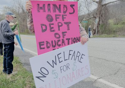 Man with protest signs
